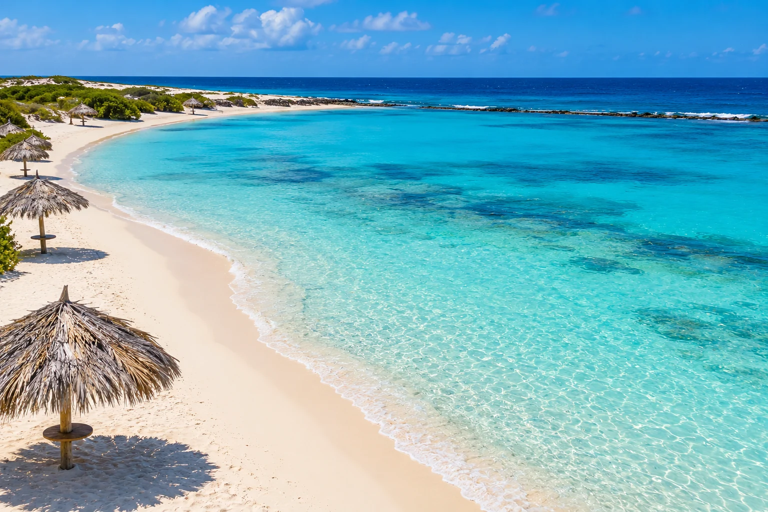 Baby Beach’s crescent of white sand, turquoise lagoon, and thatched palapas