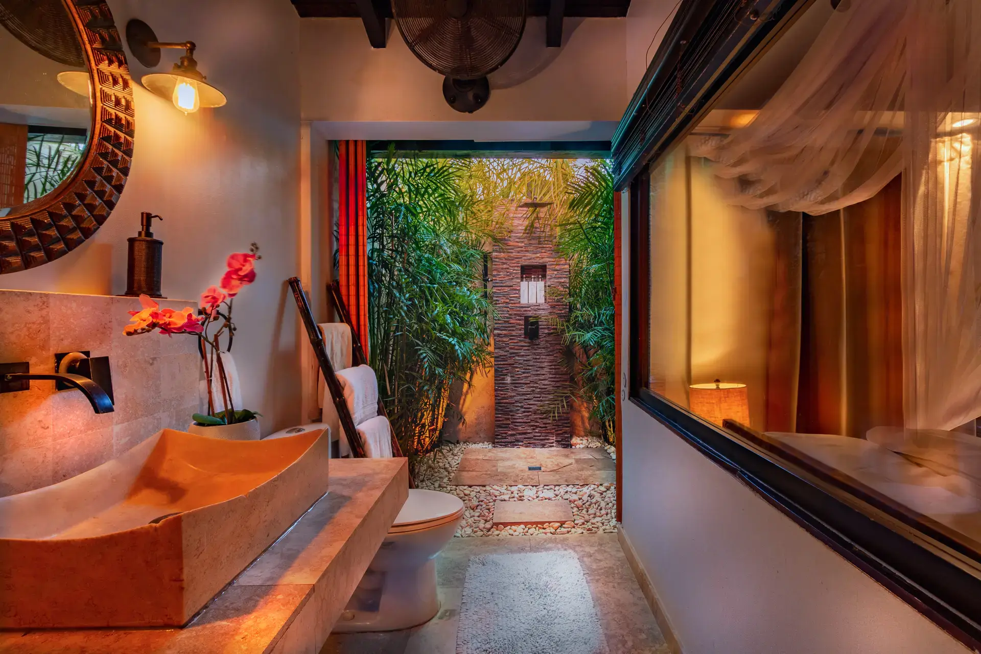 Balinese-inspired open-air ensuite bathroom in the Pool Suite at Bali Retreat Aruba.